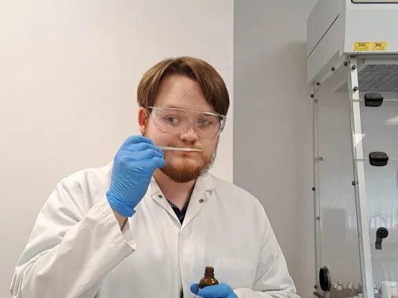 Kieren Spouge flavourist sniffing a flavour he has created
